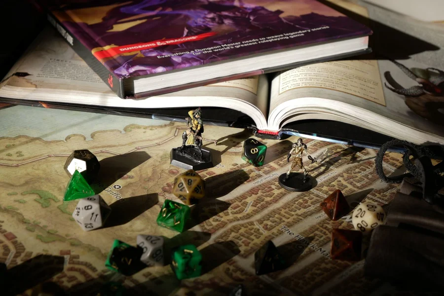 Role playing game dice and character sheet on a table