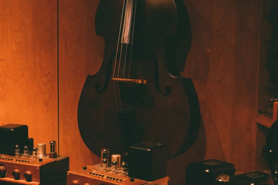 Violin string section playing in a music studio