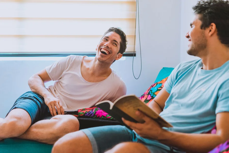 A reader laughing at a book page on a table