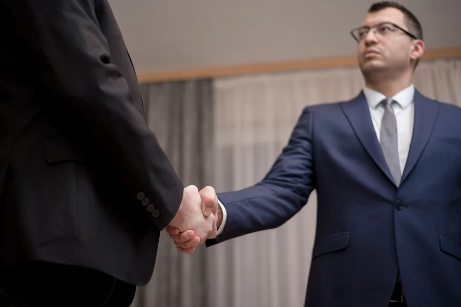 integrity partnership trust Two business partners shaking hands in agreement