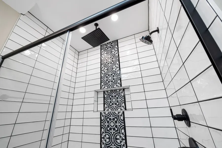 Renovated primary bathroom with walk-in shower completed by a remodeling contractor in Vero Beach