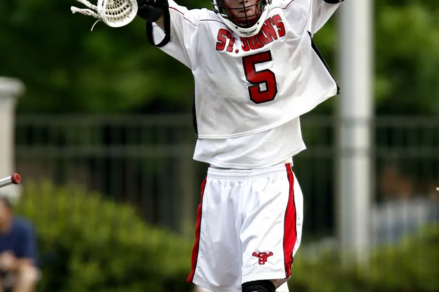offensive lacrosse midfielder run Lacrosse player running with stick cradled securely in a mid-to-low pocket setup
